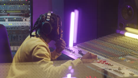 African-American-Man-Using-Mixing-Console-in-Recording-Studio